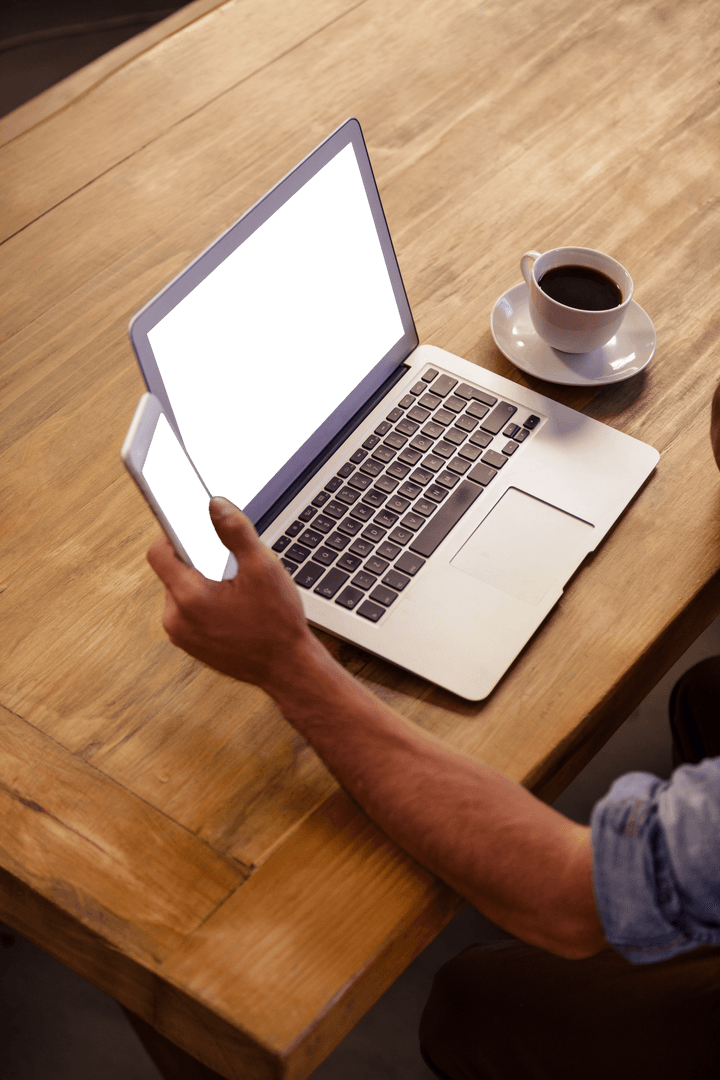 Person Using Laptop And Phone Free PNG