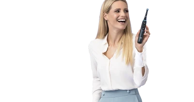Smiling Woman Holding Electric Toothbrush Free PNG